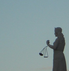 Scales of Justice by mikecogh via Flickr